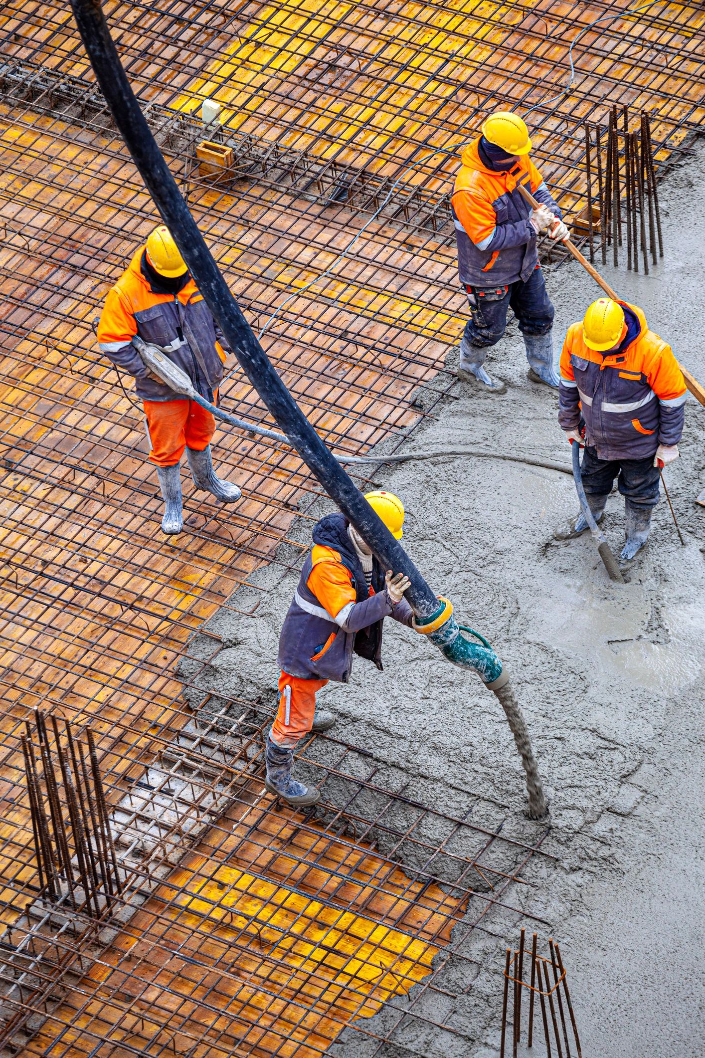 workers pouring concrete commercial