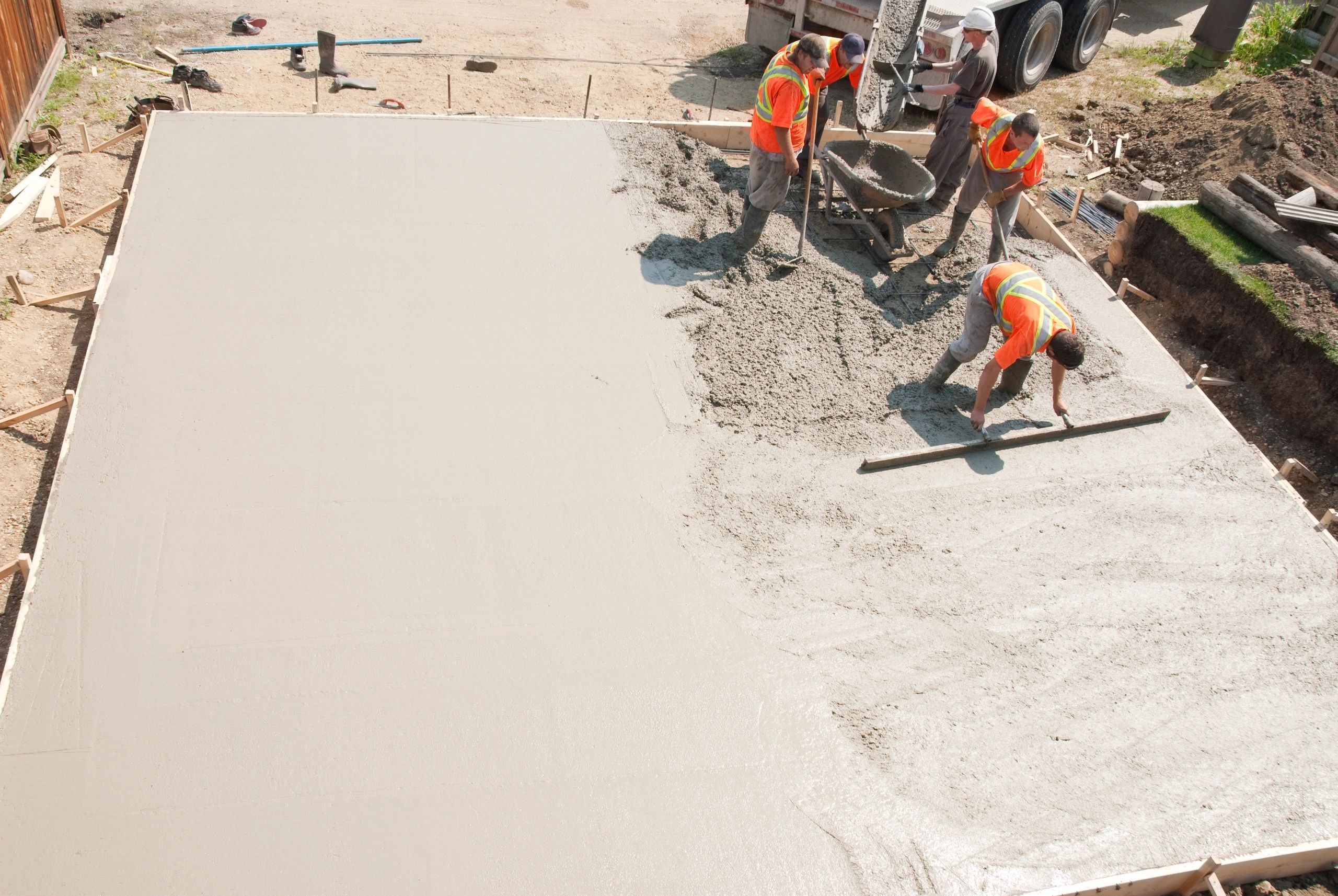 workers pouring concrete commercial